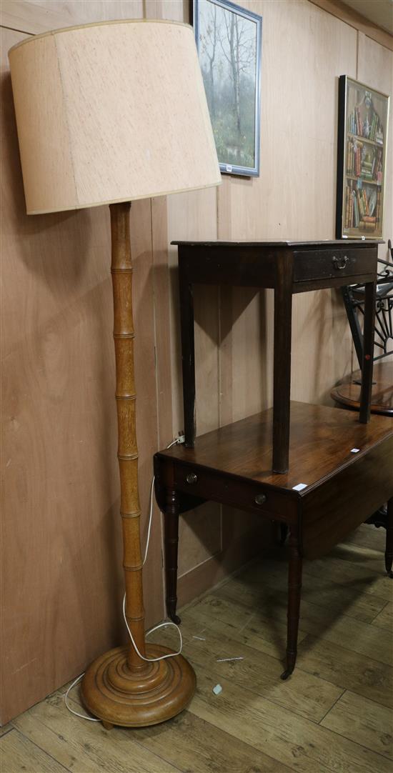 A George III oak lowboy and a simulated bamboo standard lamp table W.76cm